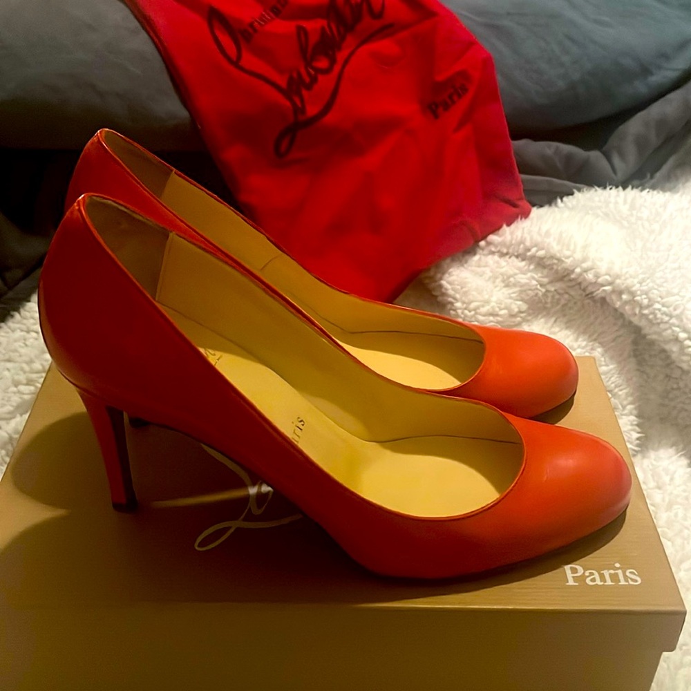 Christian Louboutin simple pumps in deep coral